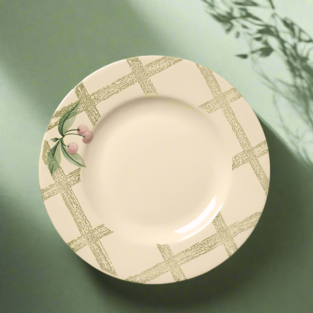 Garden Party stoneware salad plate in a vibrant garden setting, perfect for outdoor dining.