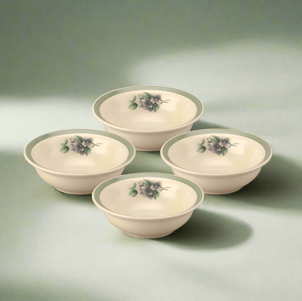 Close-up of four stoneware soup and cereal bowls stacked on a kitchen counter