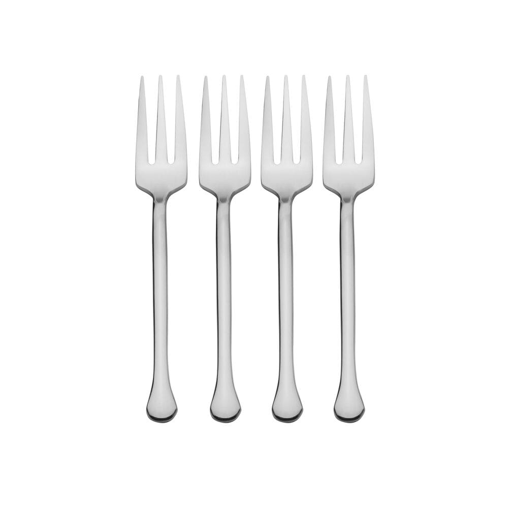 Set of four appetizer forks on a festive dining table