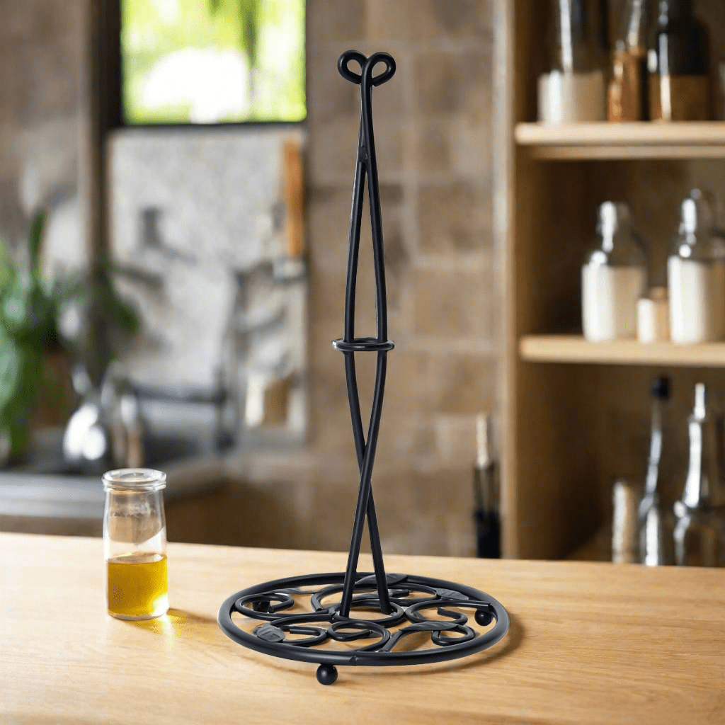 Close-up of the black iron kitchen holder showing detailed leaf pattern design