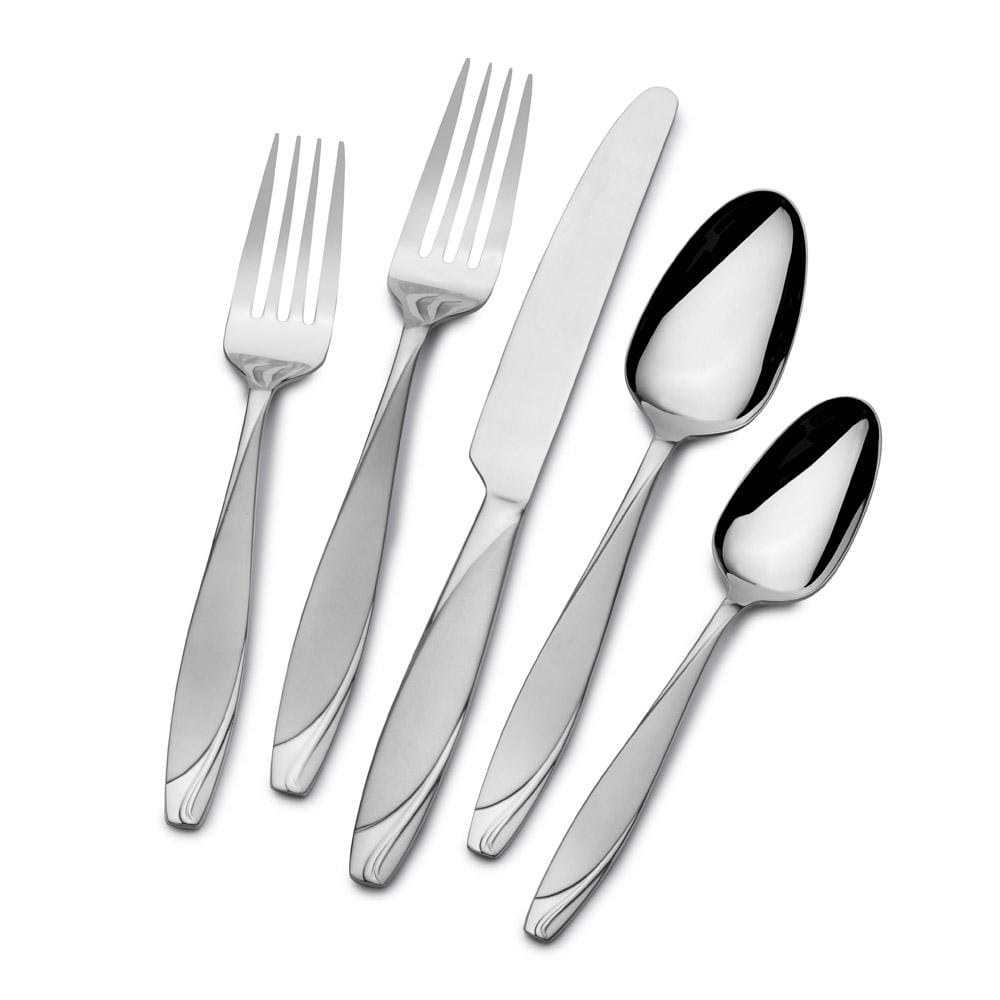 Flatware set arranged on a dining table for elegant dinner settings