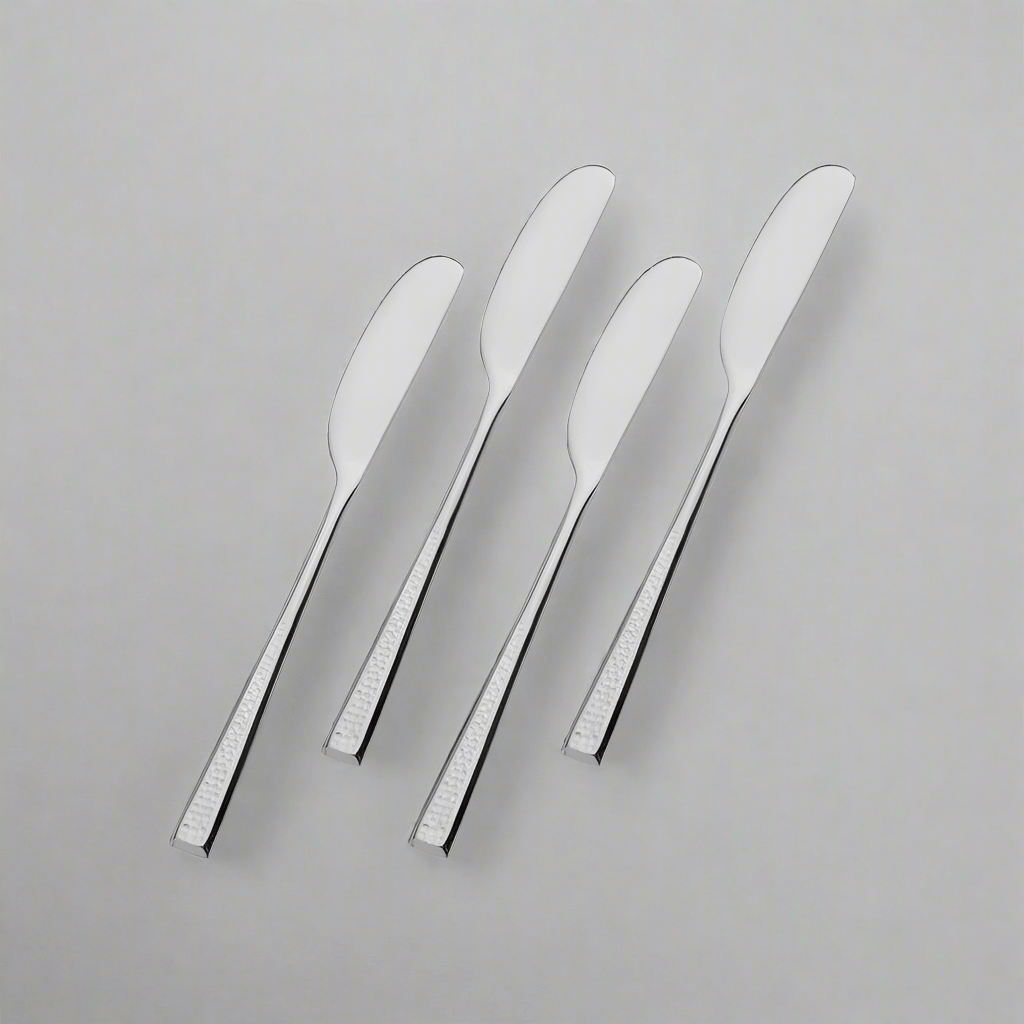 Close-up view of Towle Living stainless steel spreaders with frosted handles