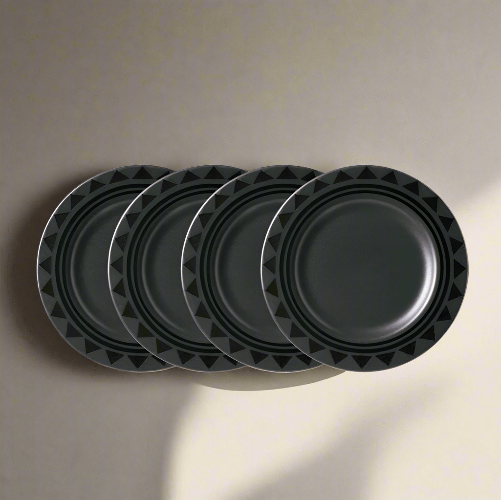 Close-up of Midnight Sun stoneware dinner plates stacked for display