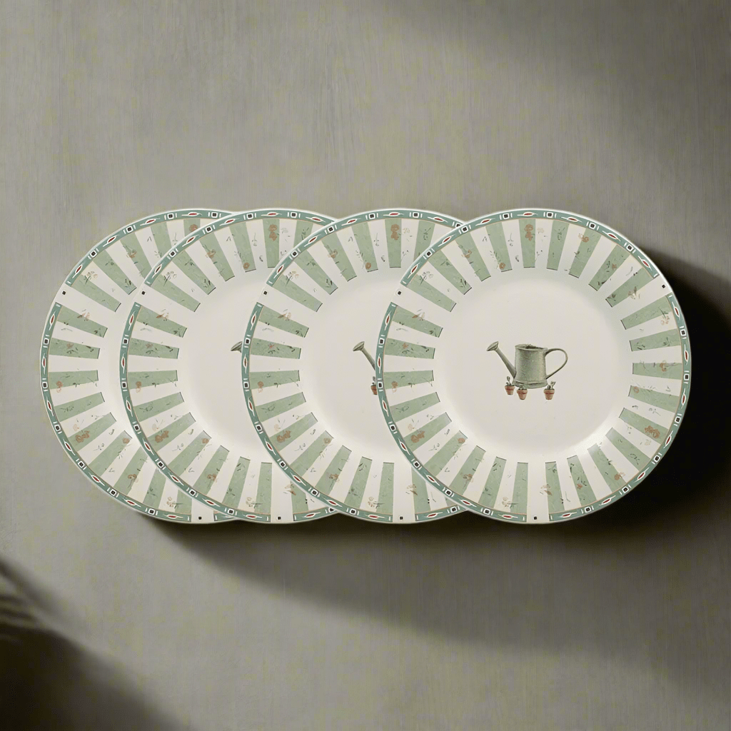 Overhead view of the 8 inch stoneware plates arranged with fruit and pastries