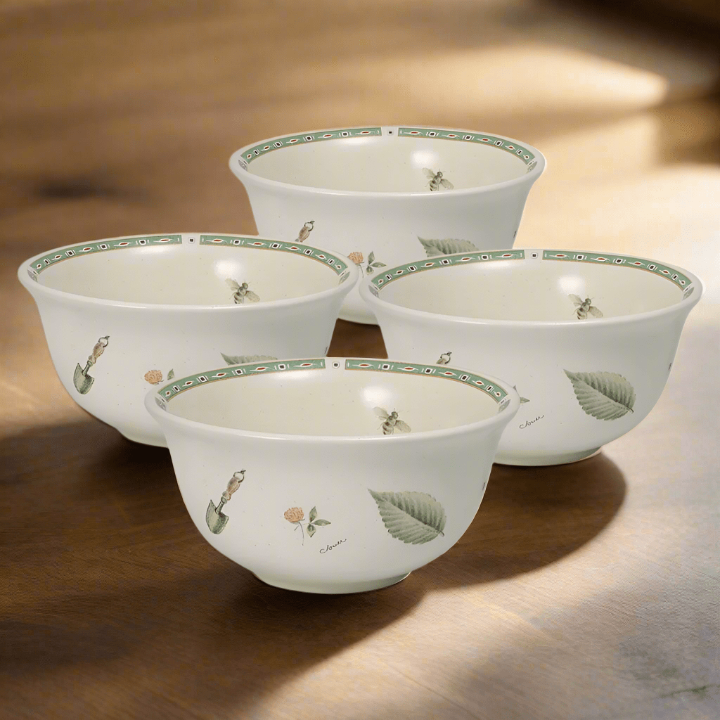 Decorative stoneware bowls with garden tool and leaf accents, stylish for kitchen display