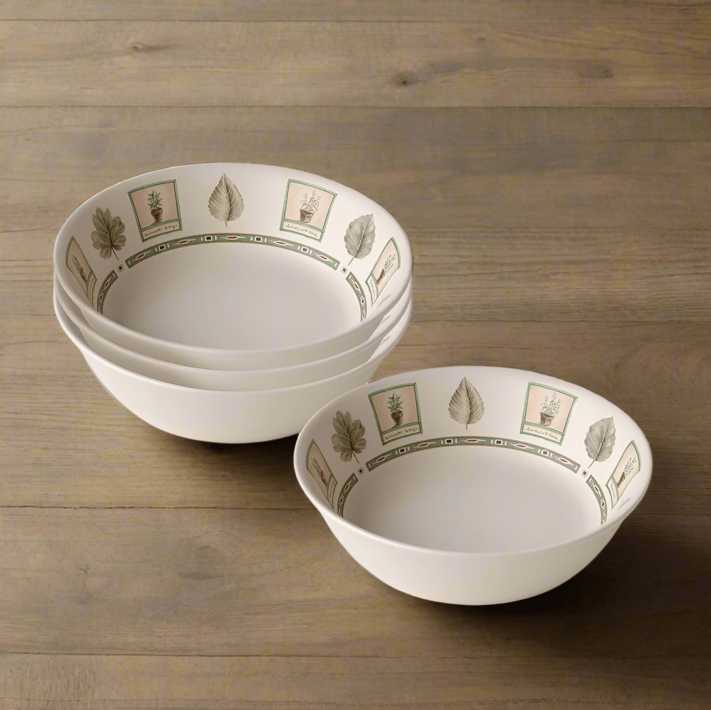 Close-up of stoneware pasta bowl with pasta and salad for serving
