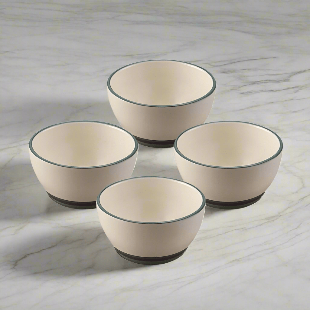 Close-up of 4 stoneware dessert bowls stacked for display