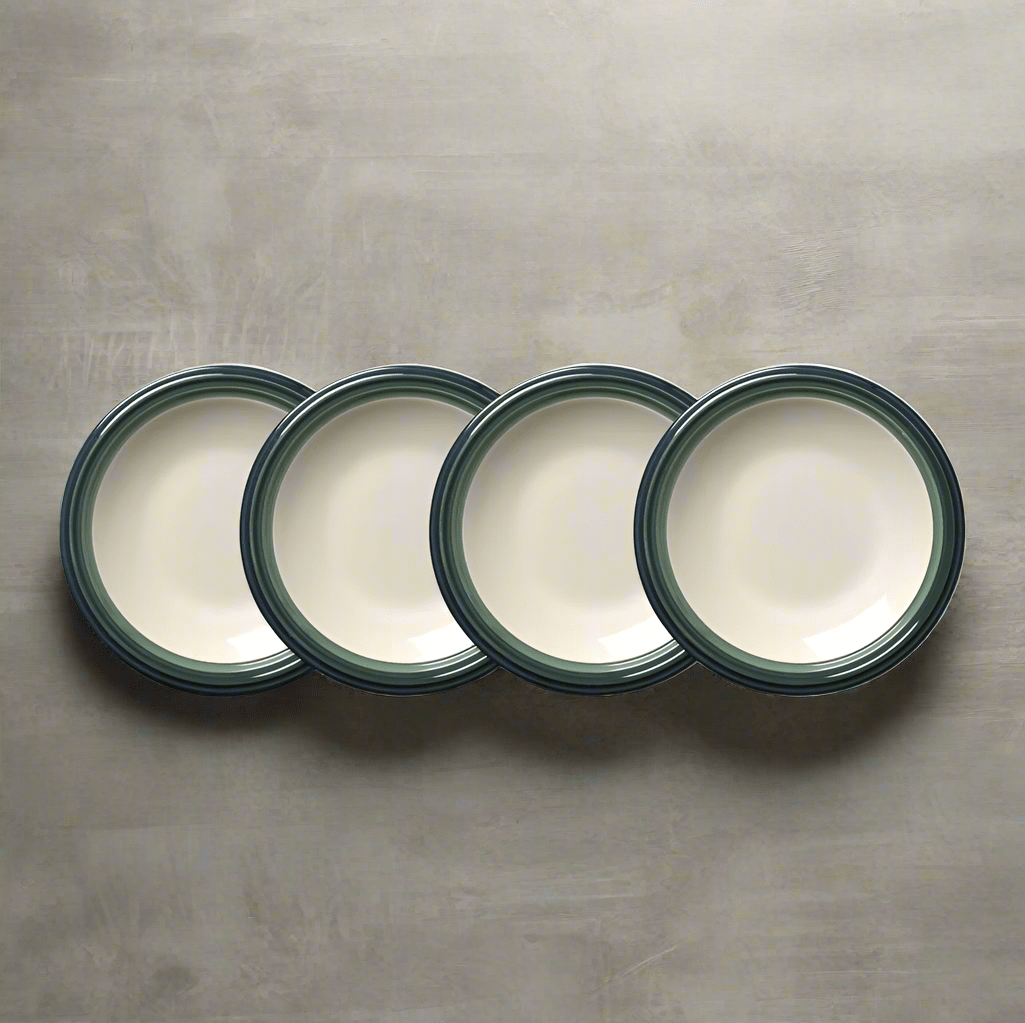 Close-up of white stoneware dinner plates with elegant design