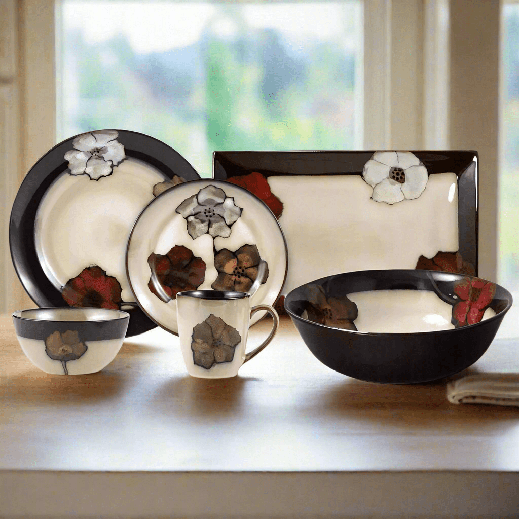 Overhead view of the Painted Poppies stoneware dinner set arranged for 8 guests, showcasing handcrafted details and reactive glaze.