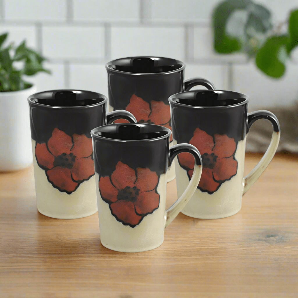 Overhead view of latte mugs showcasing unique reactive glaze and poppy patterns