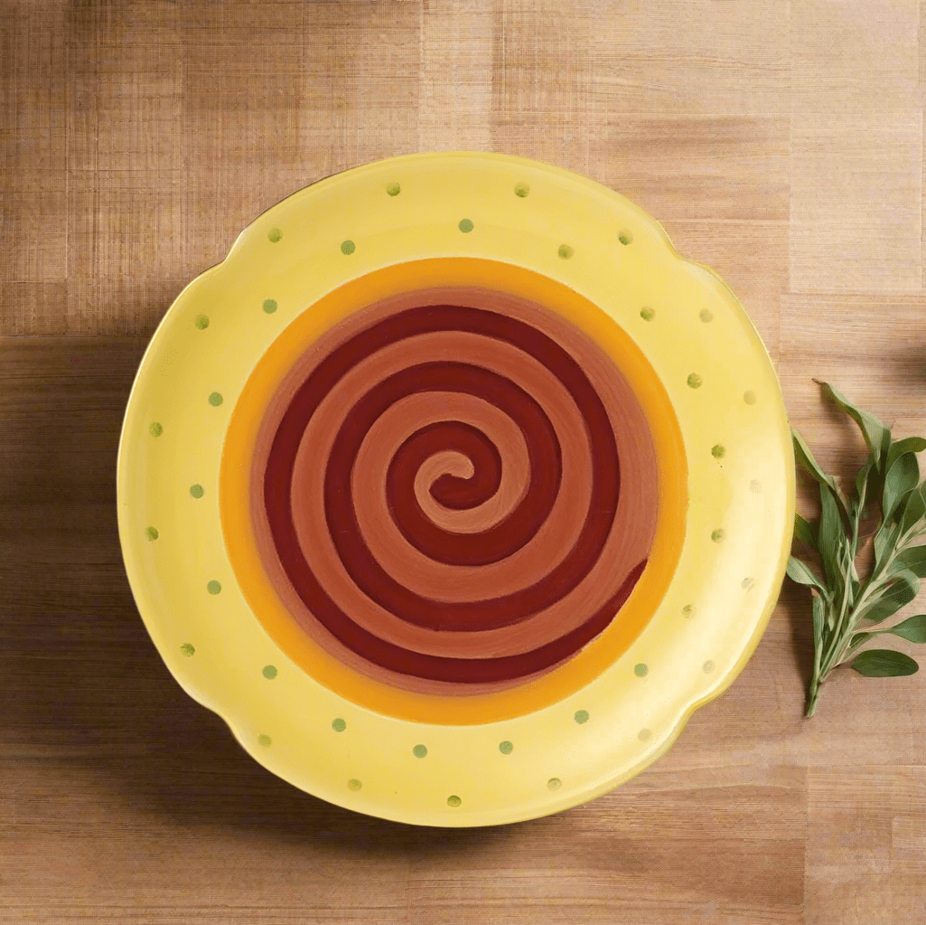 Vibrant stoneware dessert plate featuring a colorful swirl and scalloped edge, ideal for summer parties.
