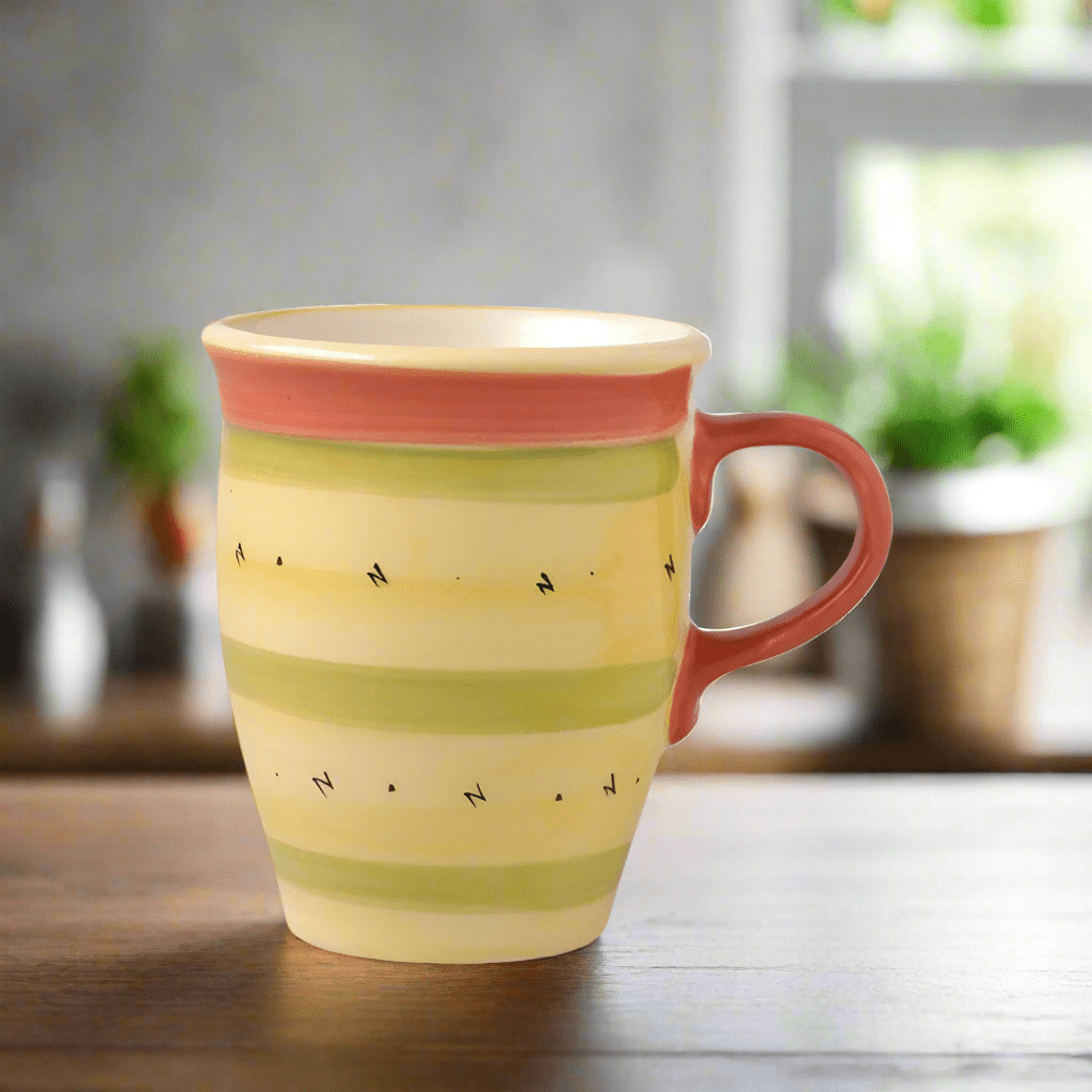 Pistoulet stoneware coffee mug with red handle, perfect for morning beverages.