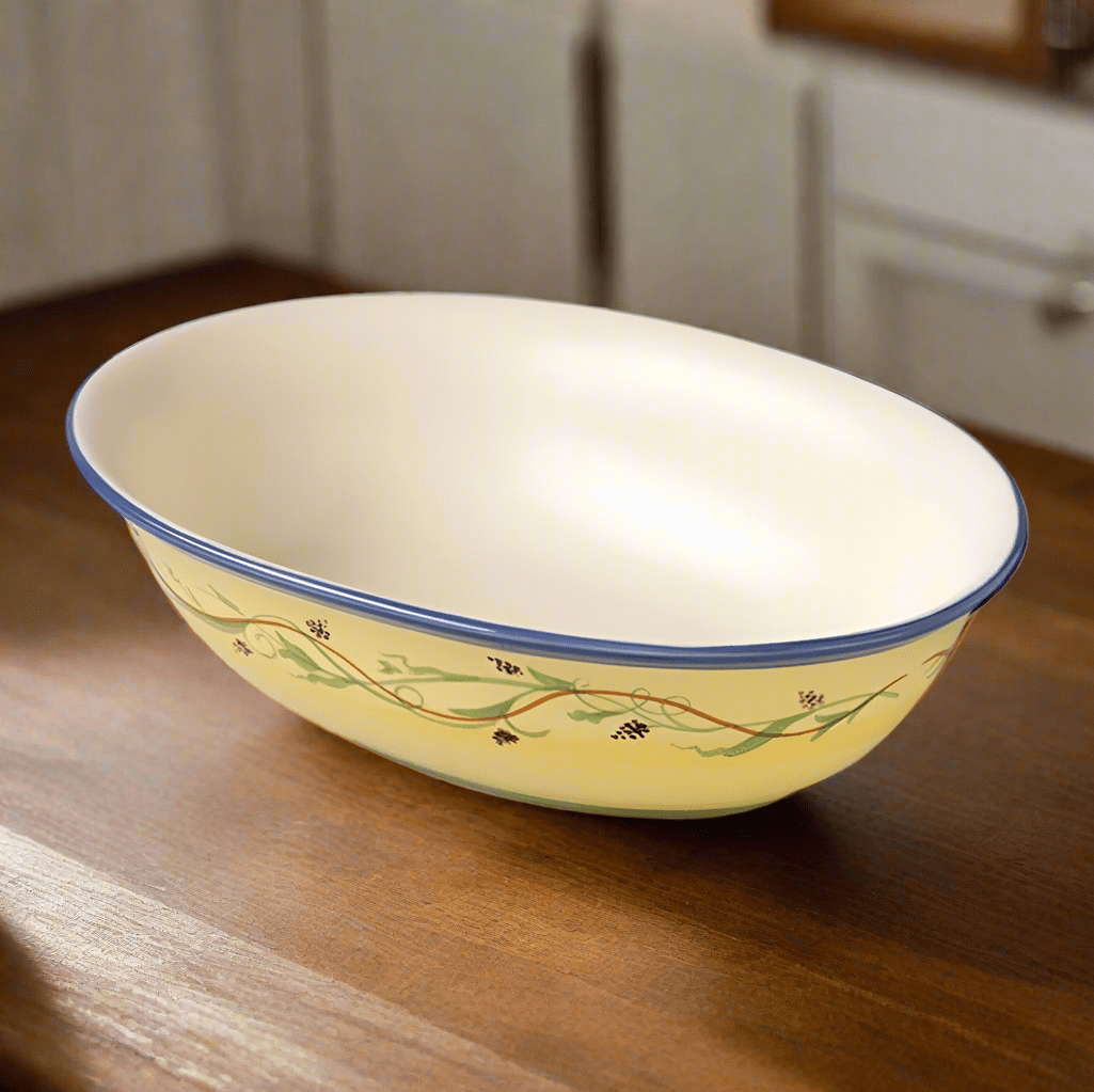 Close-up of a stoneware vegetable bowl with fresh salad inside