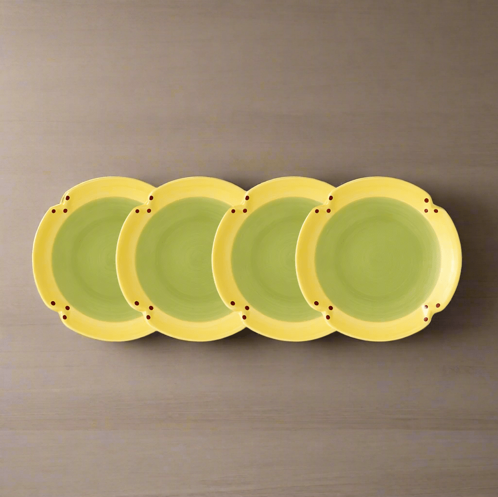 Close-up of Pistoulet stoneware dessert plates stacked, showcasing their elegant design