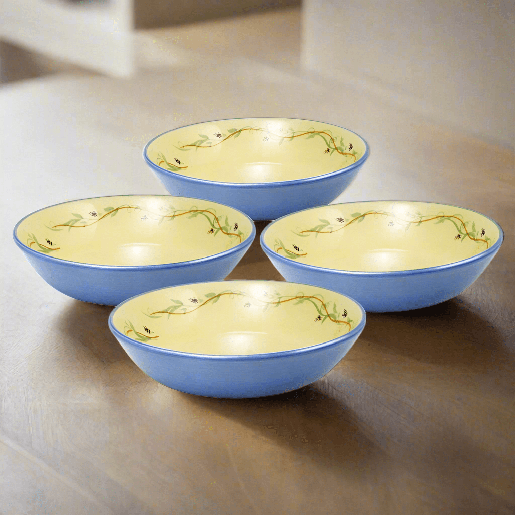 Set of four stoneware salad bowls stacked, ready for serving