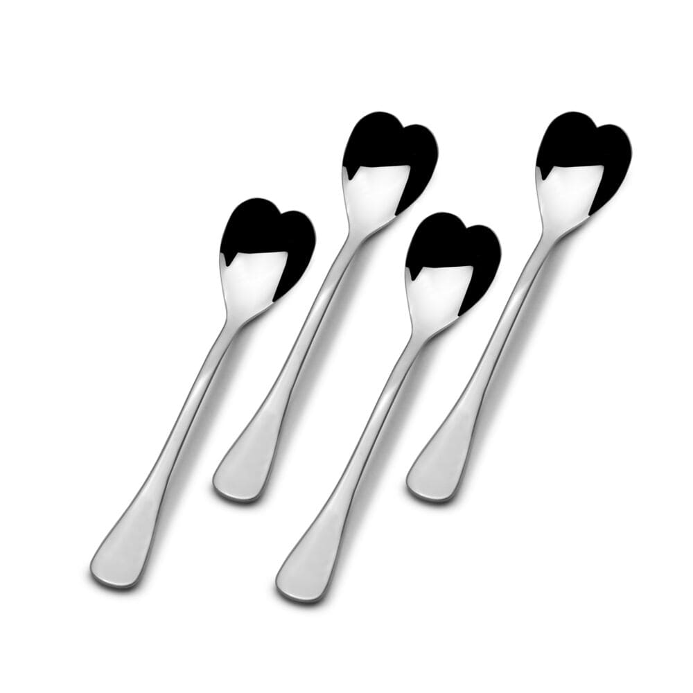 Mini coffee spoons with heart-shaped heads stirring coffee in a cup