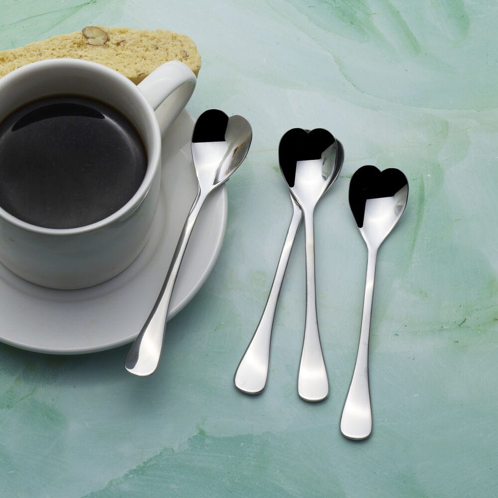 Elegant set of stainless steel coffee spoons arranged on a table