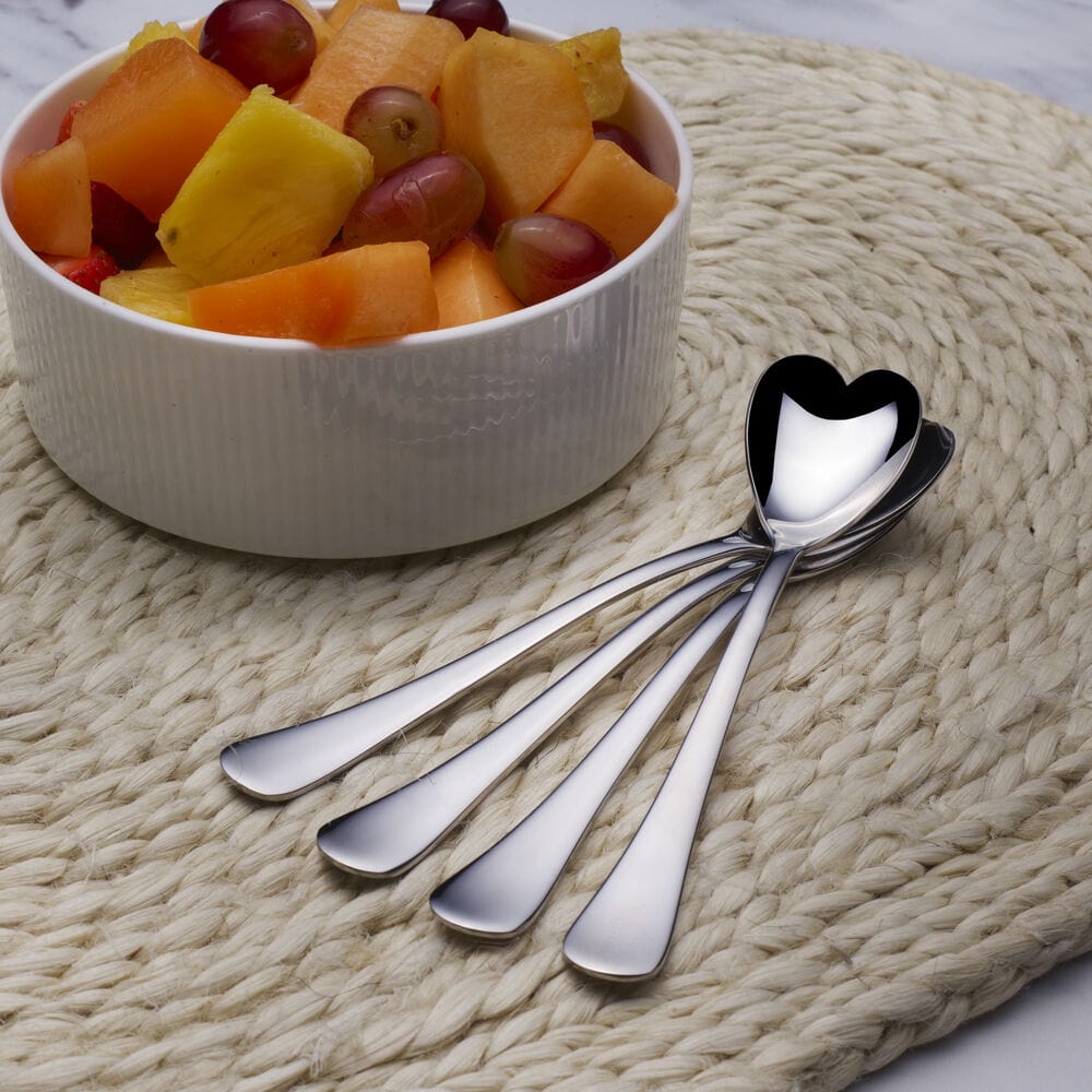 Close-up of heart-shaped ice cream spoons showing intricate design.