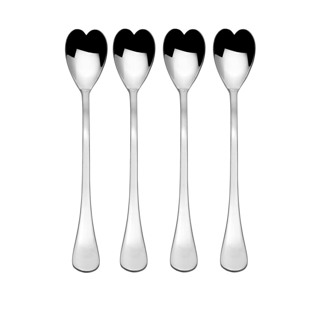 Close-up of heart-shaped spoon stirring coffee with cream.
