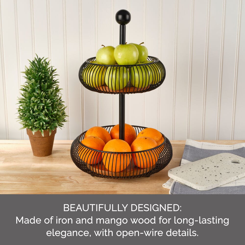 Stylish tiered basket on kitchen counter filled with fresh fruits and vegetables