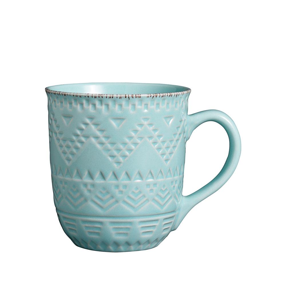 Close-up view of the teal stoneware cereal bowls and dinner plates.