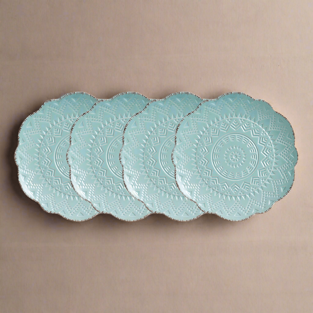 Pfaltzgraff teal salad plates showing intricate patterns and scalloped edges