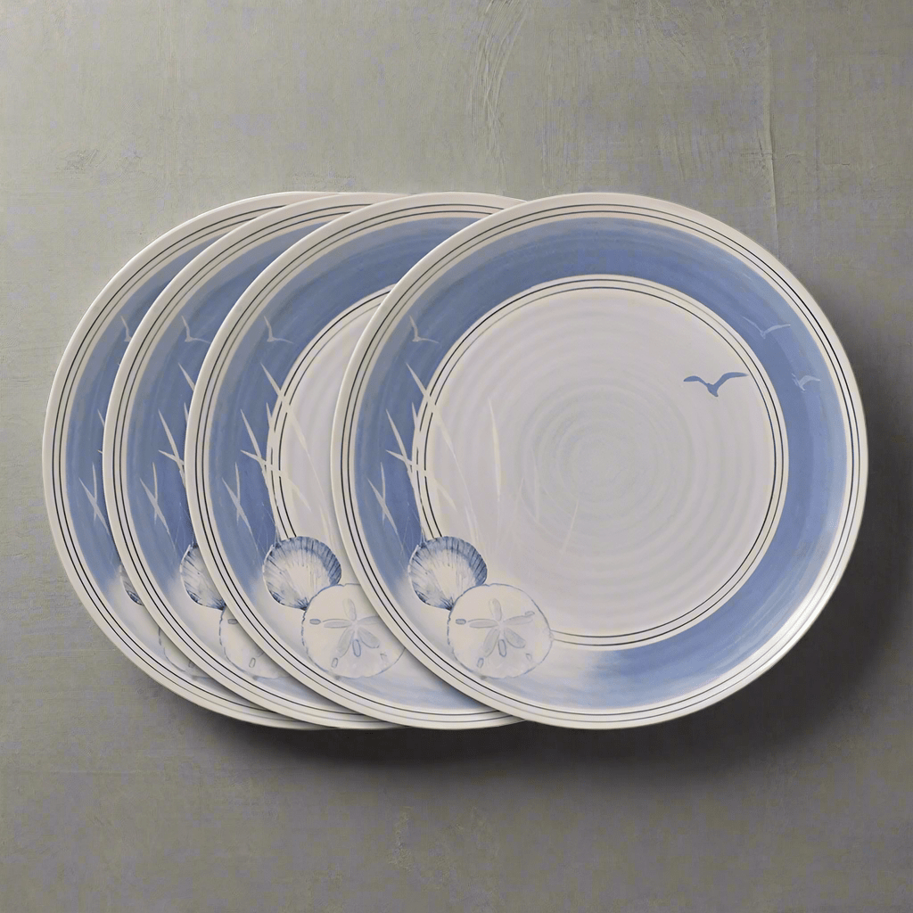 Close-up of Rio Beach House outdoor melamine dinner plates set on a picnic table.