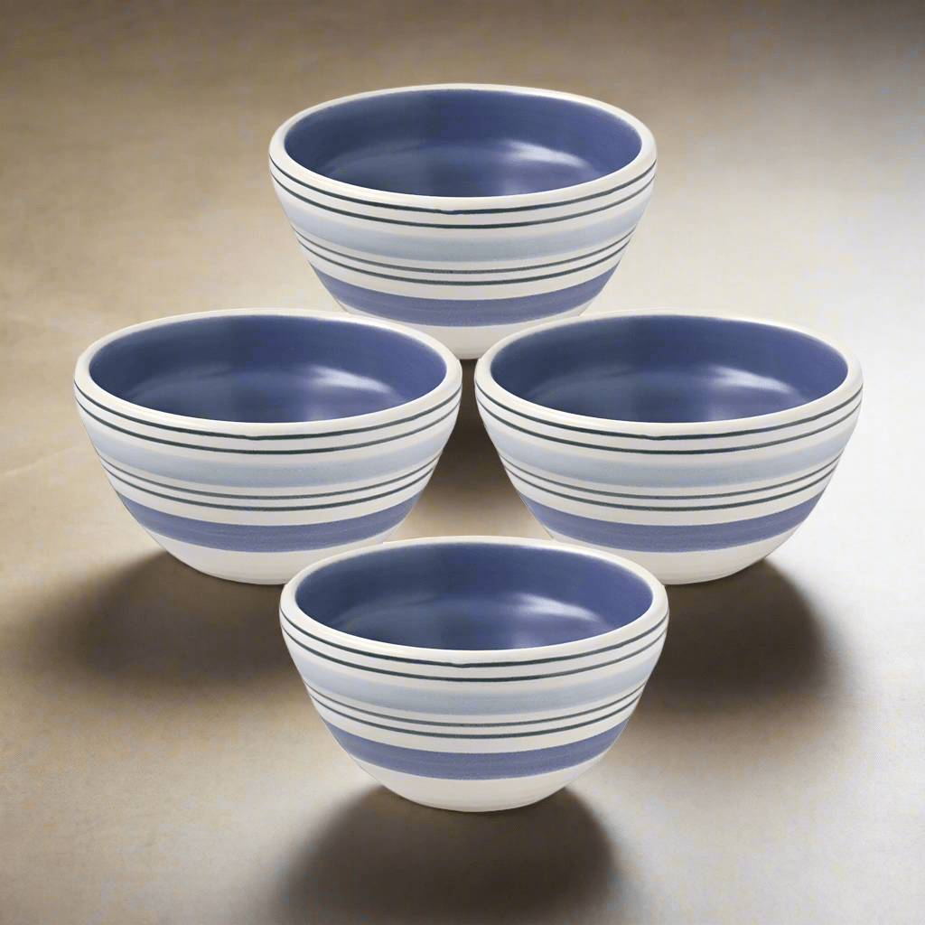 Set of four stoneware dessert bowls arranged on a table, perfect for serving desserts or snacks