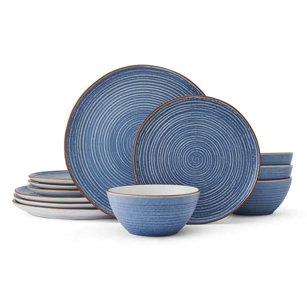 Set of blue stoneware dishes displayed on a dining table, perfect for everyday use