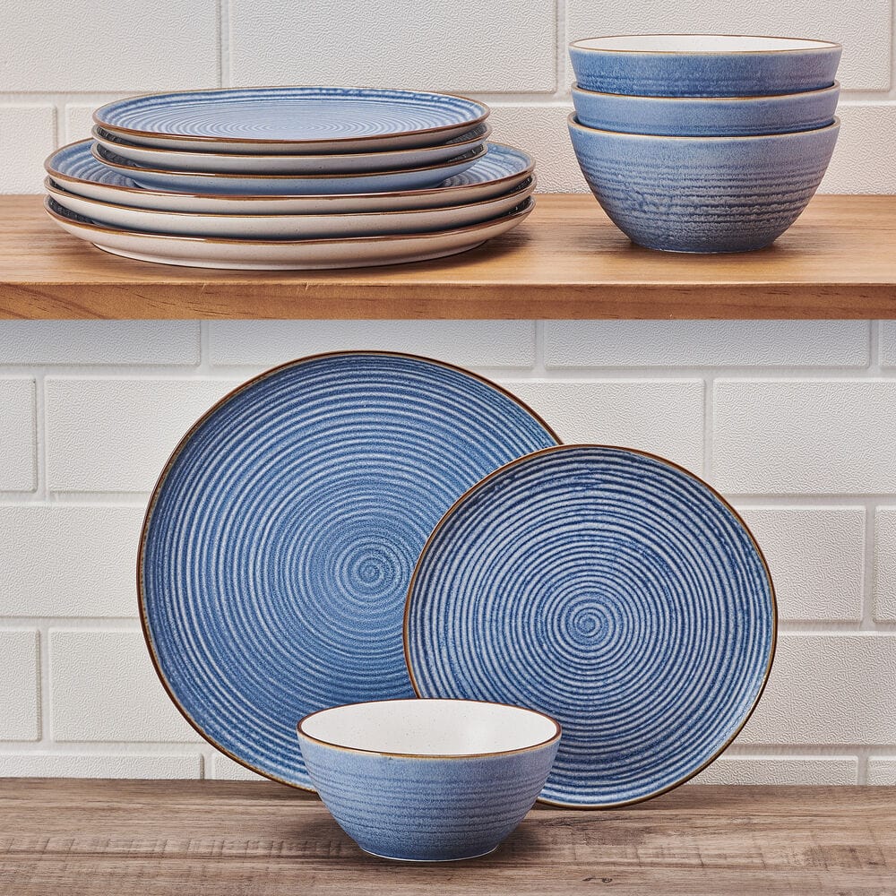 Rowan Blue dinner plates featuring concentric circles and a warm tan rim from an overhead angle