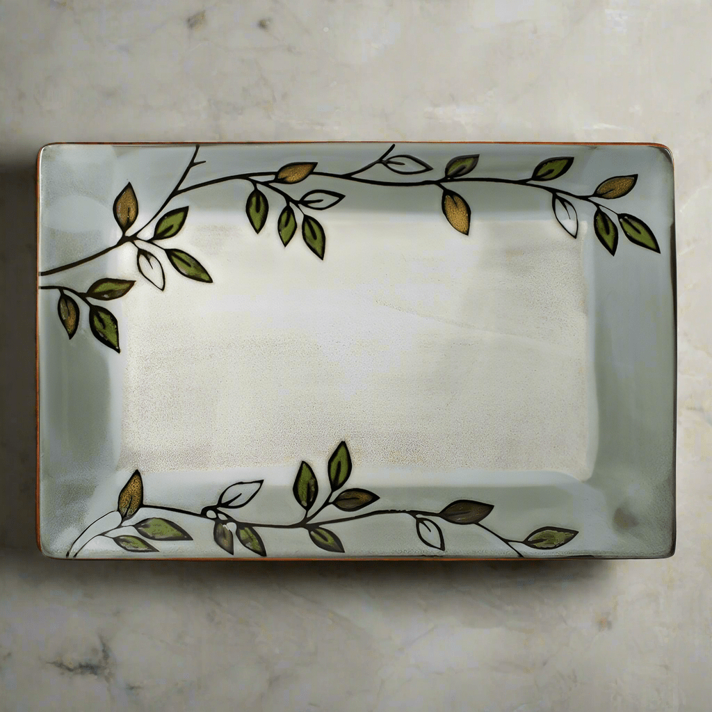 Close-up of rustic leaves design on handcrafted stoneware platter