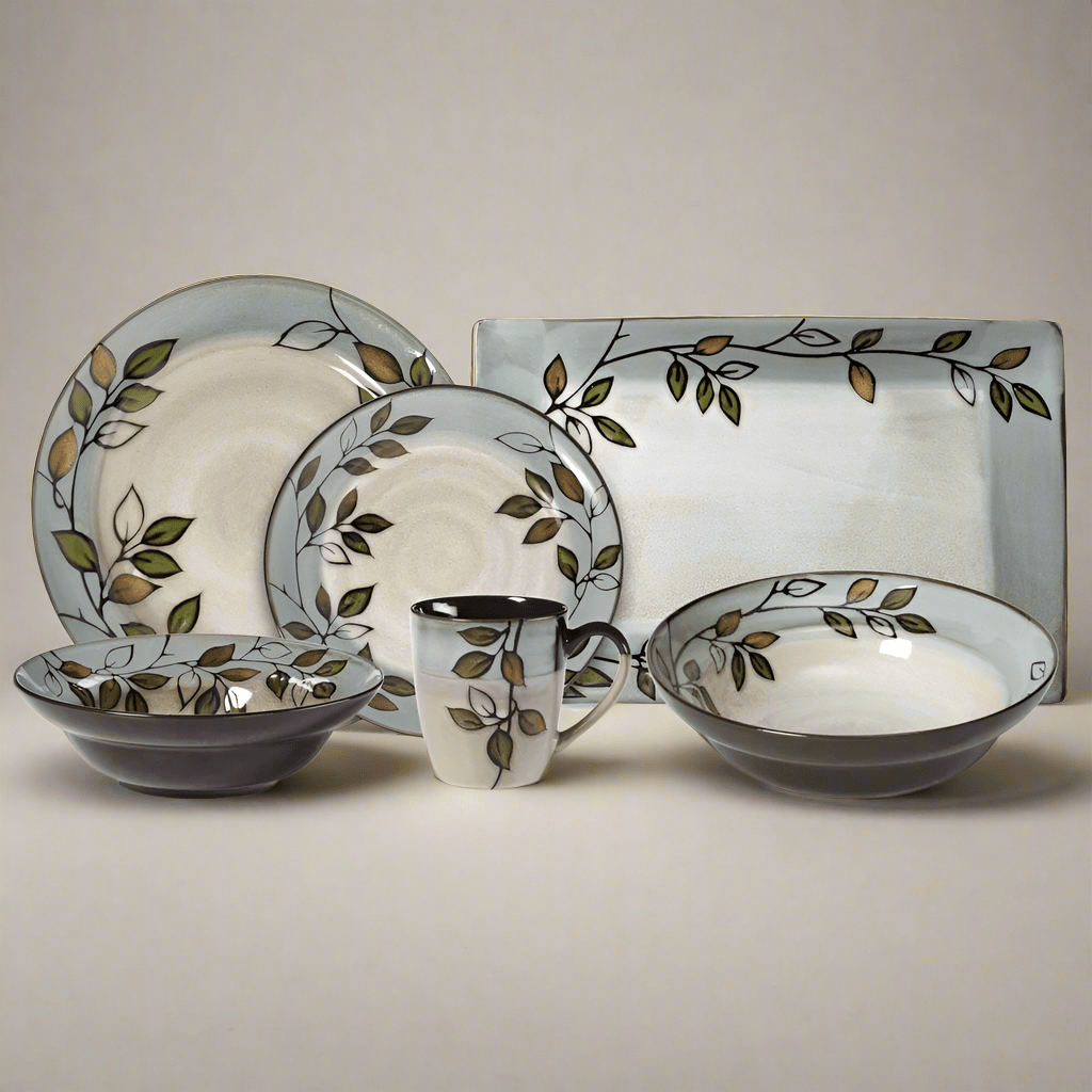 Rustic Leaves stoneware dinnerware set for 8 with plates and bowls on a rustic table