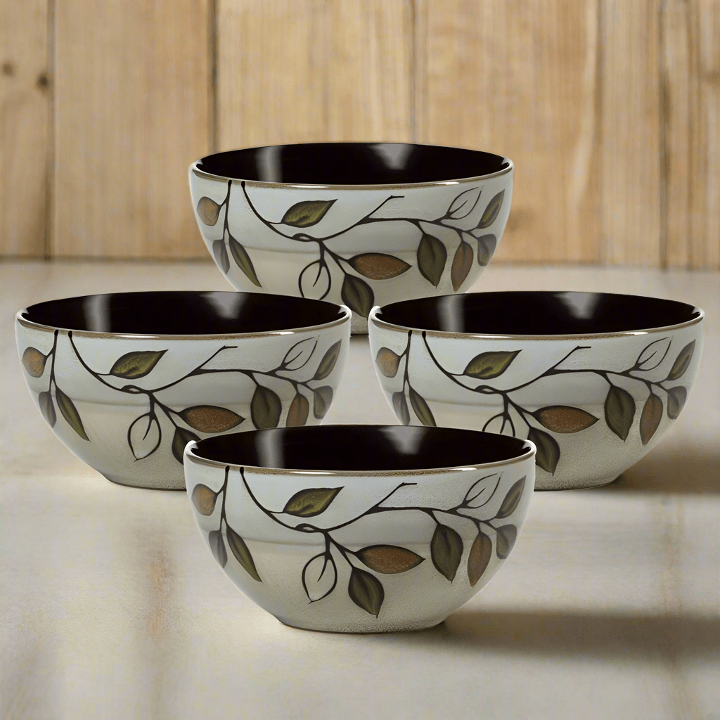 Close-up of rustic leaves soup bowls with reactive glaze finish