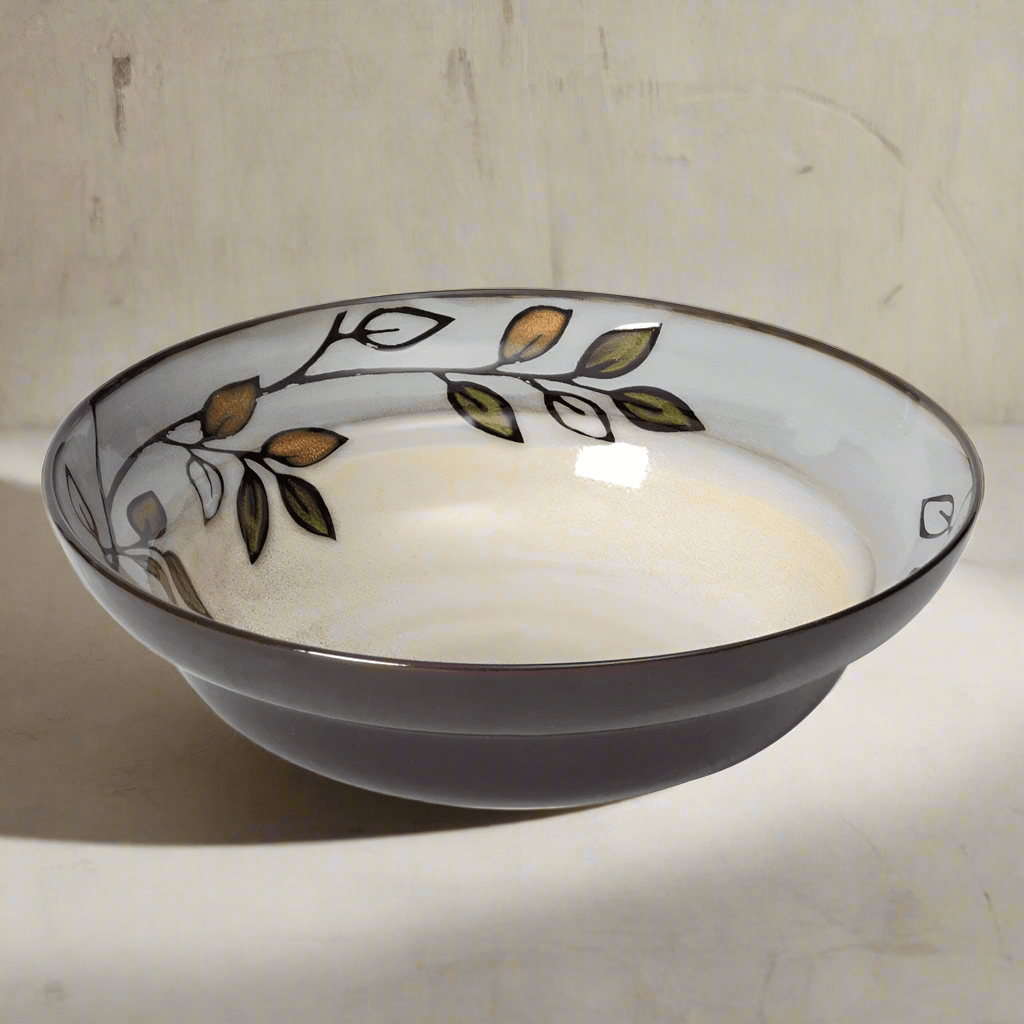 Close-up of the rustic leaves pattern on the stoneware vegetable bowl