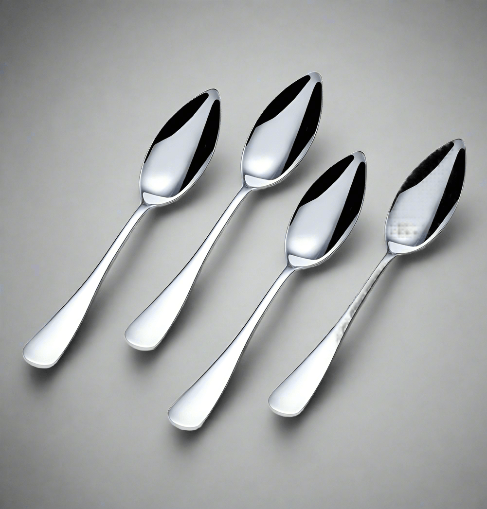 Close-up of 4-piece stainless steel grapefruit spoon set highlighting the serrated edges.
