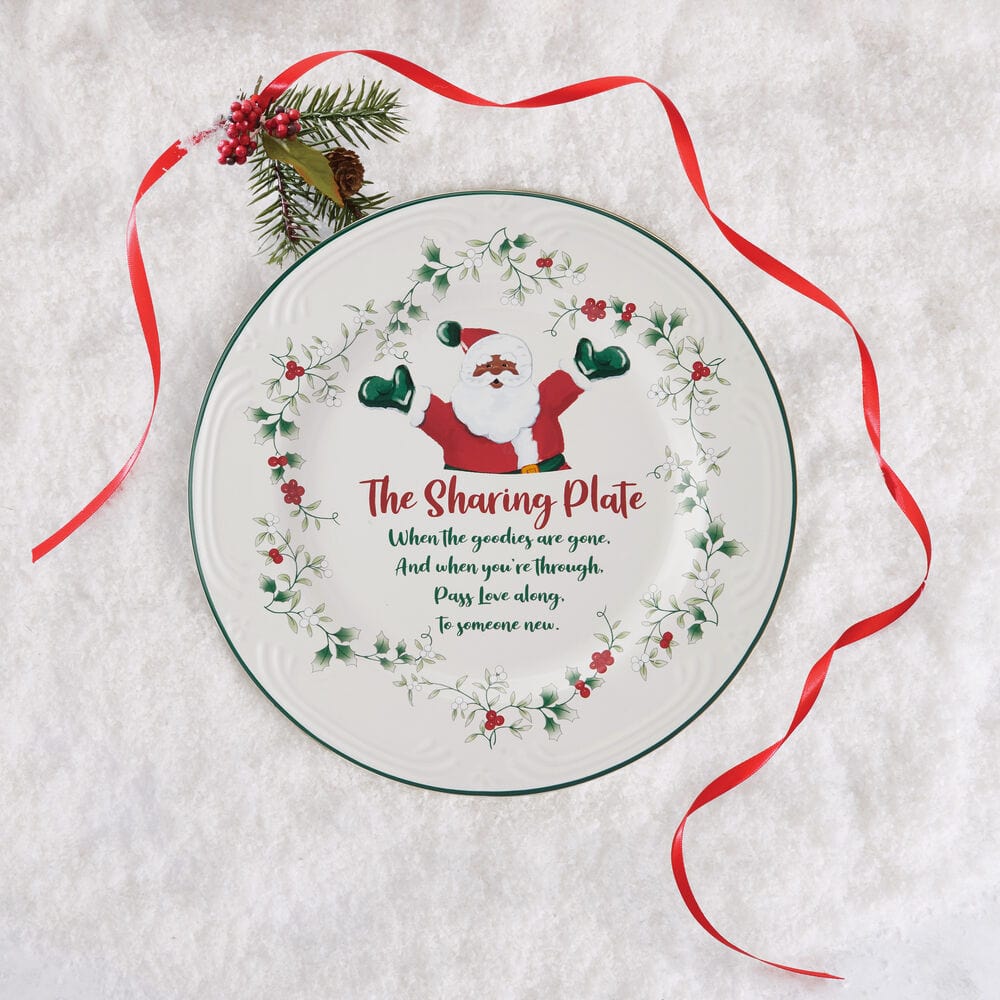 Winterberry dinnerware set featuring the African American Santa sharing plate at a holiday dinner table.