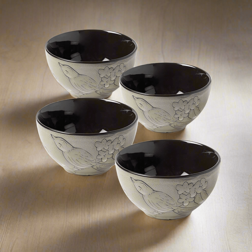 Close-up of handcrafted stoneware fruit bowls with reactive glaze pattern
