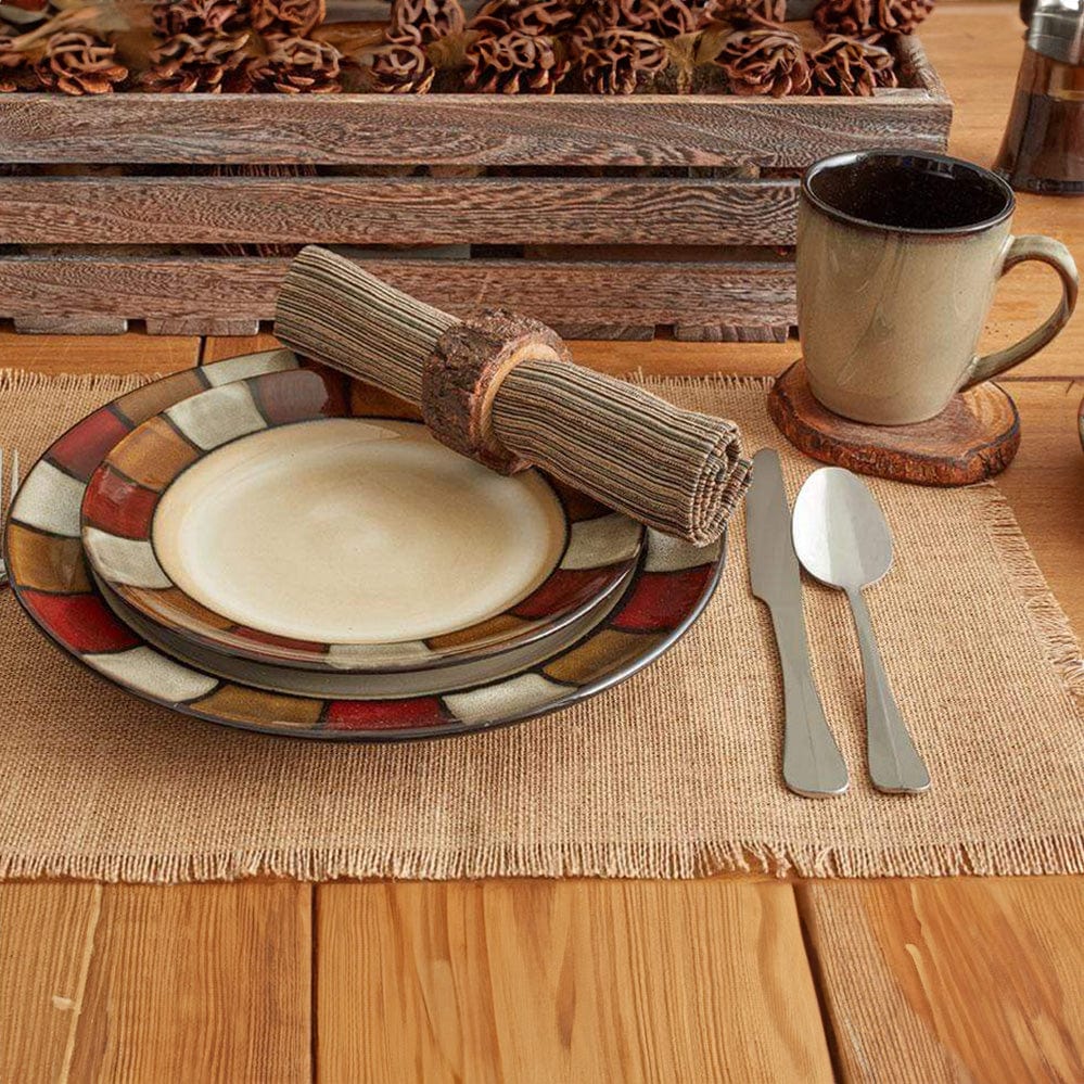 Side angle of mugs and bowls from the Taos 16 piece dinnerware set on a rustic table