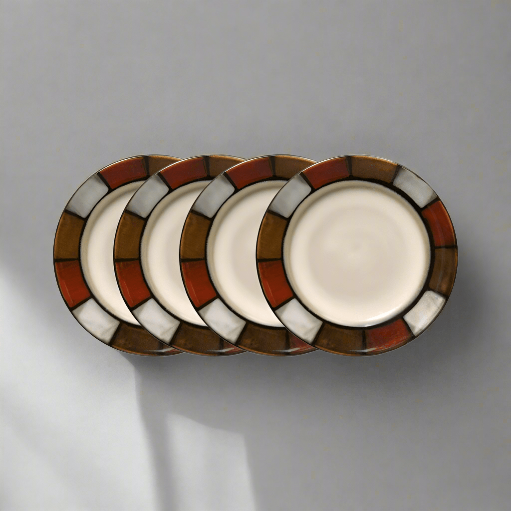 Close-up of handcrafted reactive glaze stoneware appetizer plates showing unique color variations