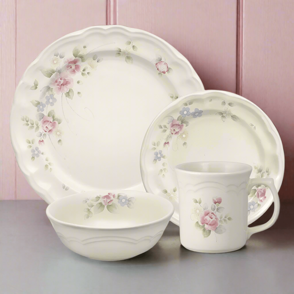 Close-up of the elegant scalloped edge dinnerware set showcasing watercolor roses and scalloped edges.