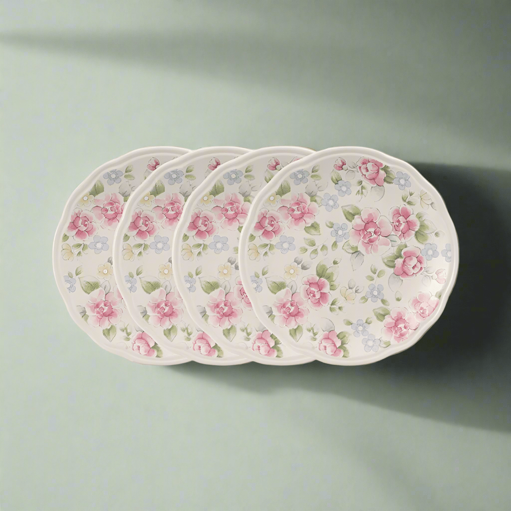 Close-up of Tea Rose accent luncheon plates showing floral design and 9-inch size