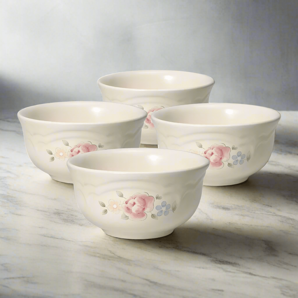 Close-up of the elegant Tea Rose stoneware dessert bowls stacked together