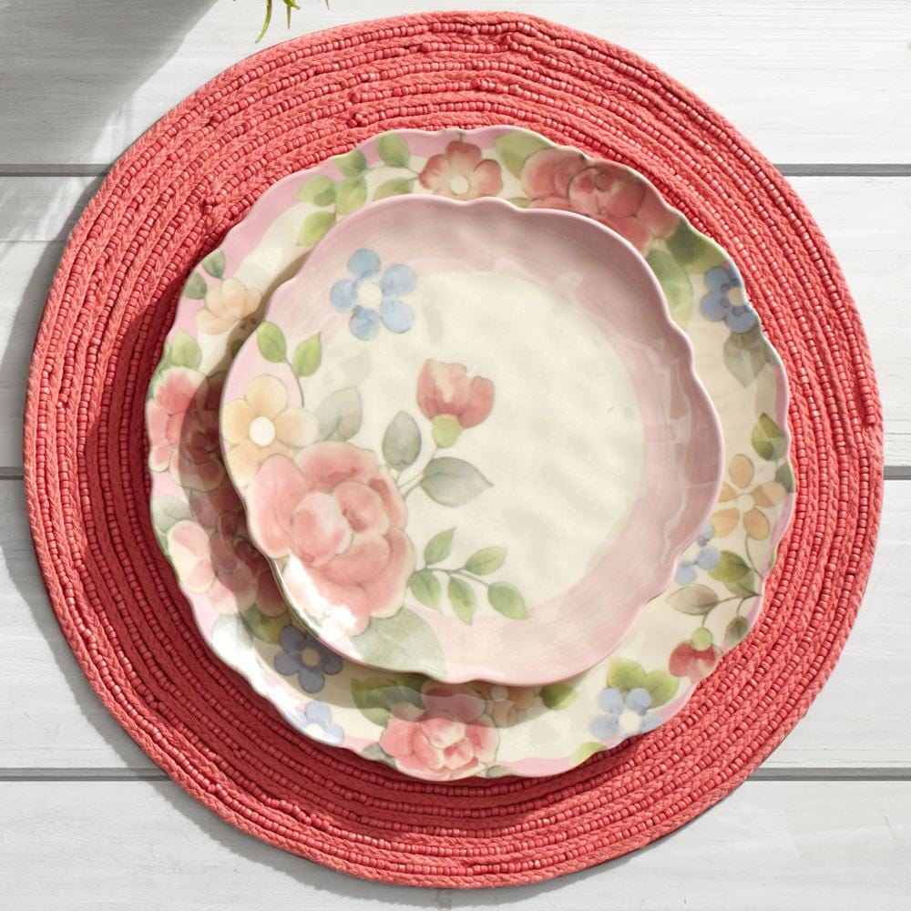 Close-up of watercolor rose pattern on melamine dinner plate for outdoor dining