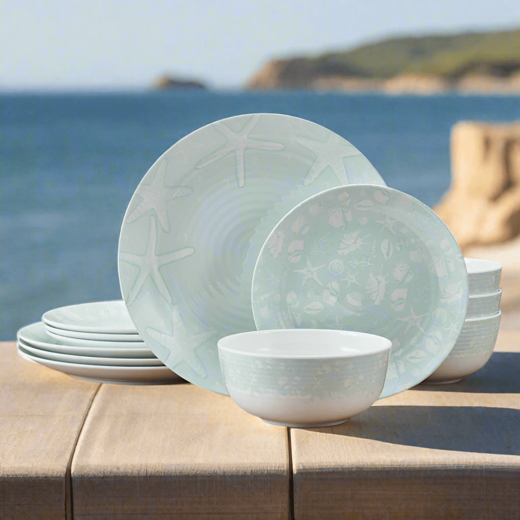 Coastal Breeze outdoor melamine dinnerware set displayed on a picnic table with vibrant starfish and seashell patterns.