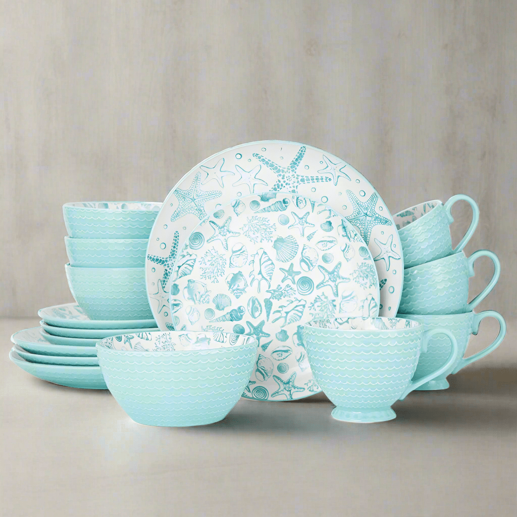 Close-up of the vibrant teal coastal dinnerware set with starfish patterns.