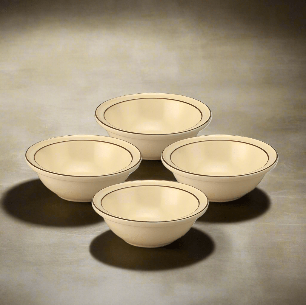 Close-up of Village stoneware bowls with cereal on a breakfast table