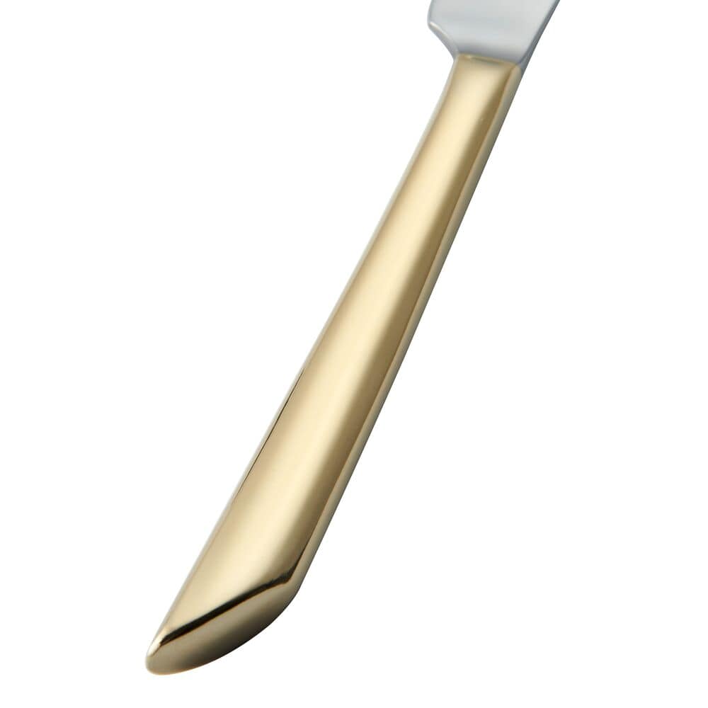 Gold Wave 20-Piece Flatware Set arranged for a dinner party setting.