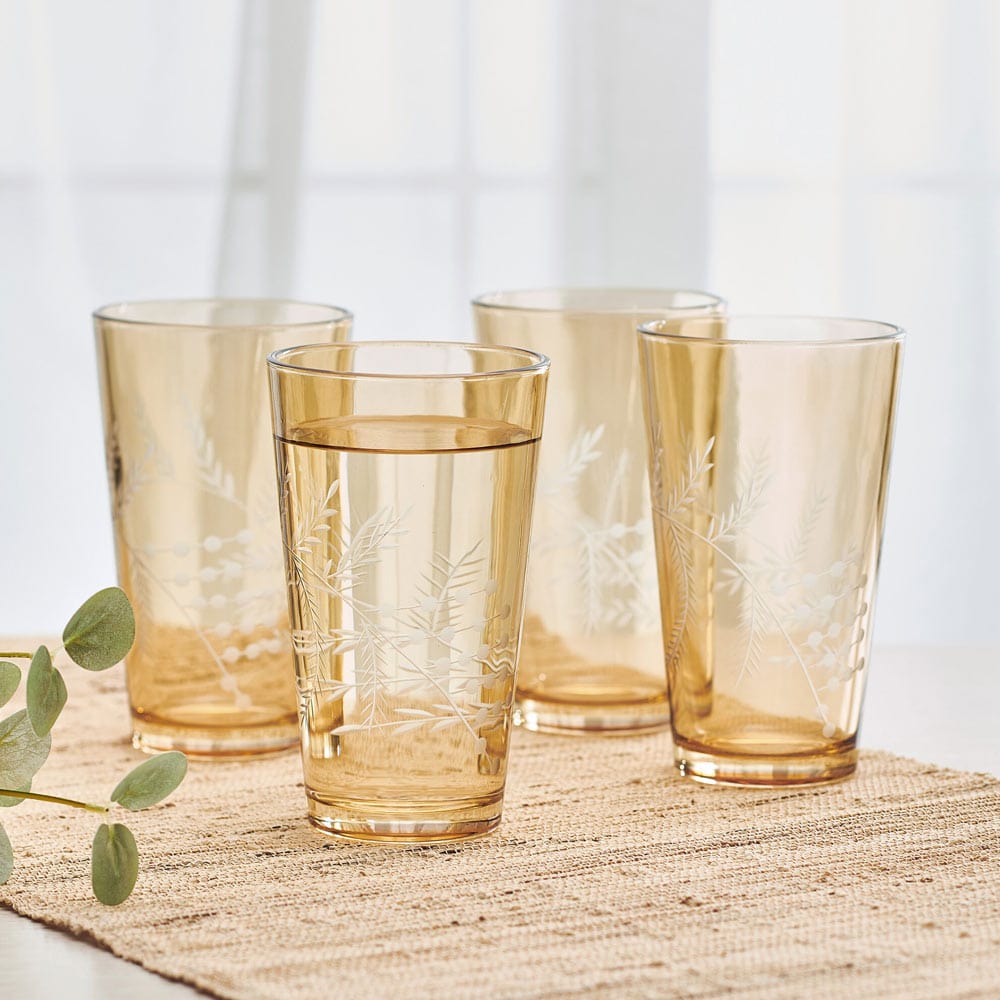 Fitz & Floyd gold highball glasses set of 4 with wildflower design, ideal for serving cocktails at parties.