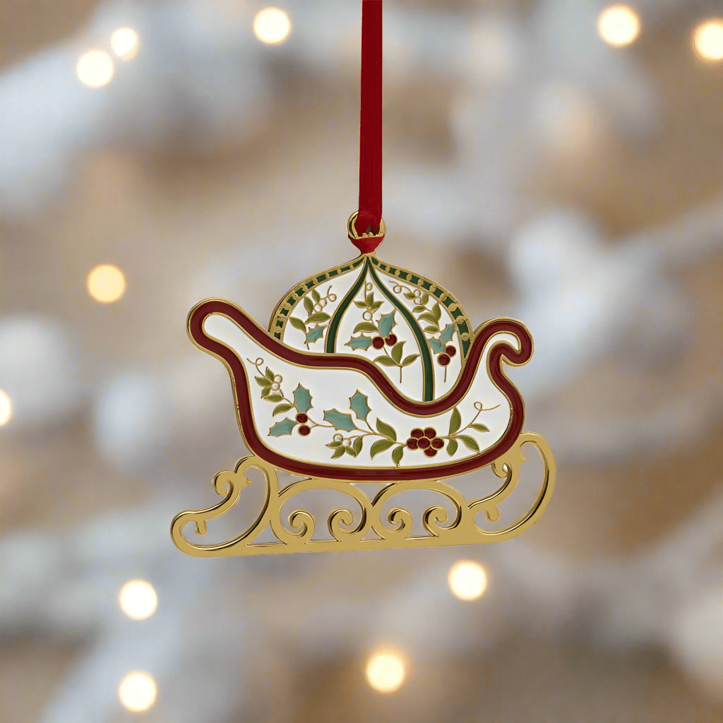 Close-up view of the Elegant Winterberry Gold Plated Christmas Ornament showcasing its beautiful enamel design.
