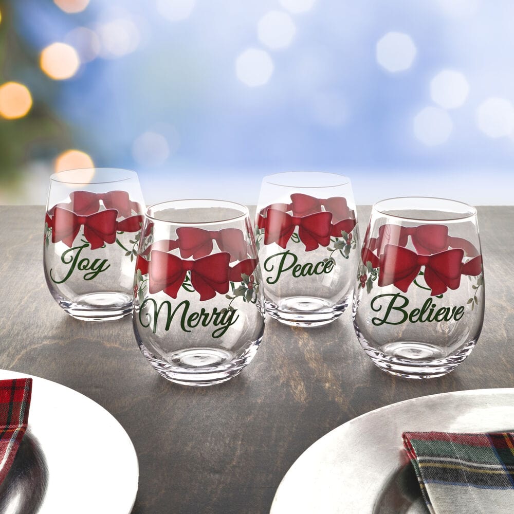 A close-up of the Winterberry stemless wine glasses showing the unique sentiments.